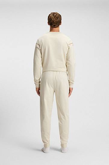 Спортни панталони BOSS Cotton-terry tracksuit bottoms with side tape and vertical logo Бежово | 50550613, 1