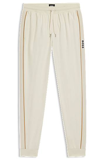 Cotton-terry tracksuit bottoms with side tape and vertical logo
