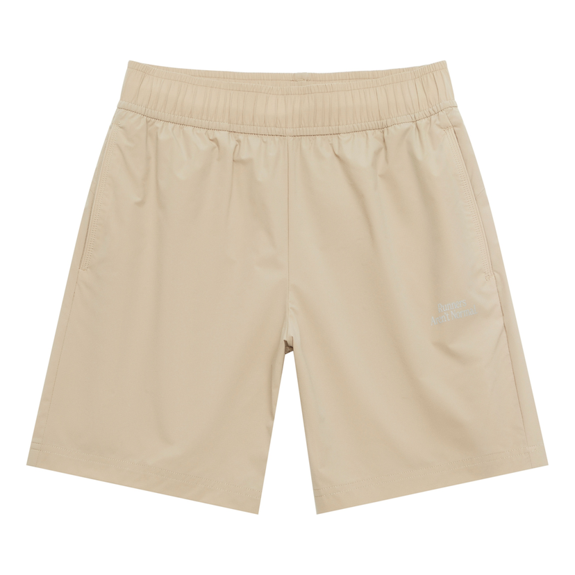 Къси панталони New Balance Woven Logo Shorts Бежово | NVE24121-BWN