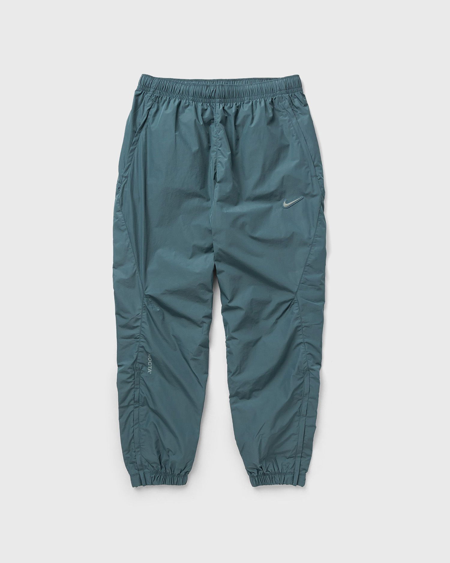 Спортни панталони Nike NOCTA x NORTHSTAR NYLON TRACKSUIT BOTTOMS Тюркоазено | FN7668-382, 0