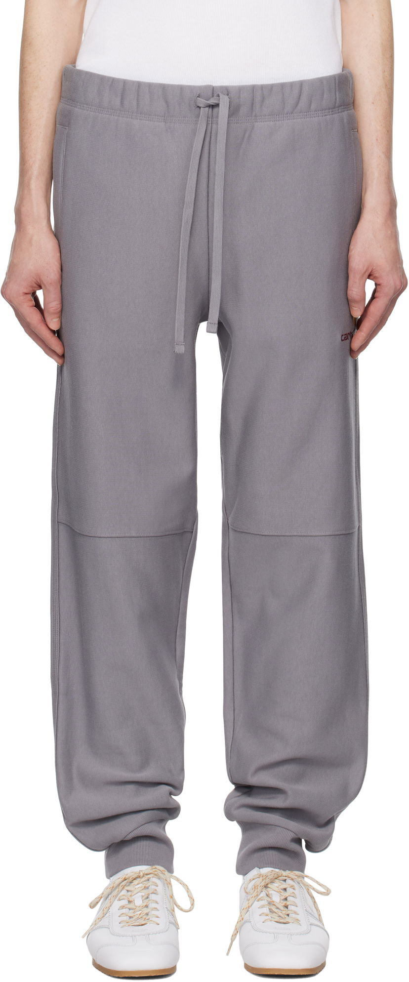 Спортни панталони Carhartt WIP Work In Progress American Script Drawstring Sweatpants with Knee Panels Сиво | I027042