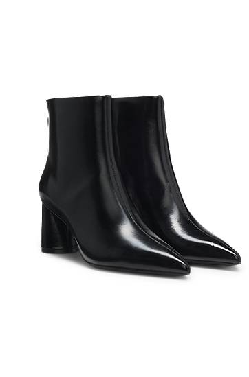 Ankle boots in leather with embossed logo