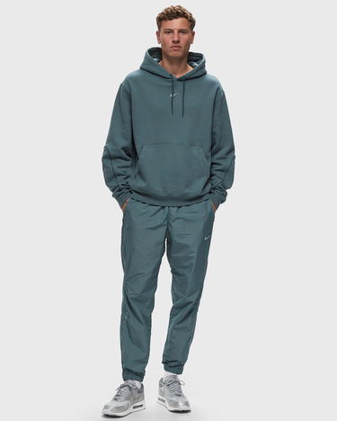 Спортни панталони Nike NOCTA x NORTHSTAR NYLON TRACKSUIT BOTTOMS Тюркоазено | FN7668-382, 1