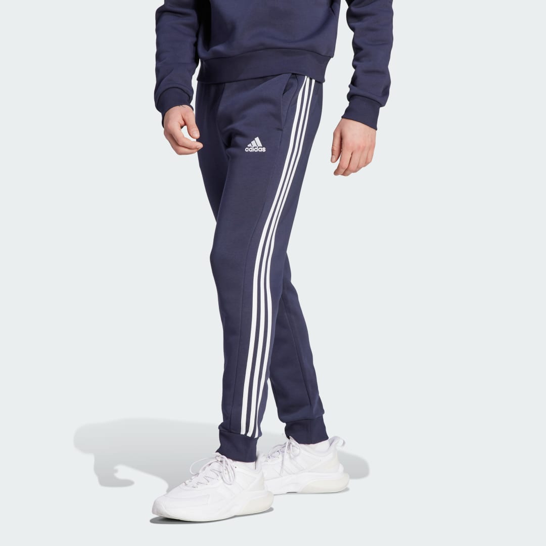 Спортни панталони adidas Originals Essentials Fleece 3-Stripes Tapered Cuff Pants Тъмно синьо | IJ6493, 0