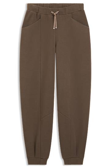 Relaxed-fit tracksuit bottoms with lustrous piping