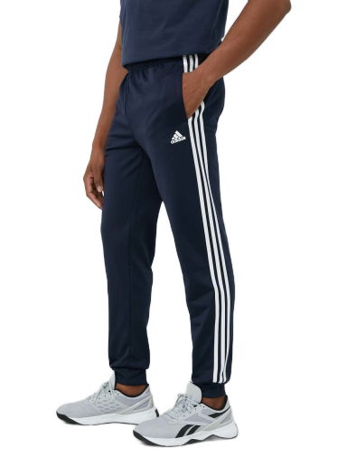 Спортни панталони adidas Originals Essentials Warm-Up Tapered 3-Stripes Track Pants Тъмно синьо | H46106